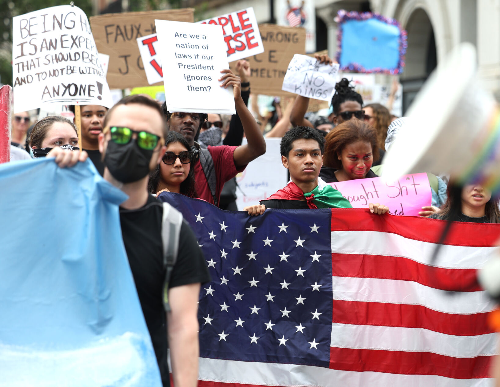 Person holds American flag.JPG